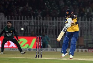 Sri Lankan batter Kamil Mishara plays a shot during the T20I Tri-Nation Series match between Sri Lanka and Pakistan at Pindi Cricket Stadium
