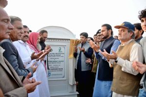 Commissioner Amir Kareem Khan offers dua after unveiling the plaque during the groundbreaking ceremony of a beautification project along a 9-kilometre stretch of the N-5 road, from Syedwala Chowk to Saho Chowk