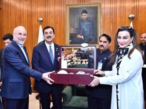 H.E. Dr. Mohammad Bagher Ghalibaf, Speaker of the Islamic Consultative Assembly of Iran presenting a painting to Acting President Syed Yousuf Raza Gilani at Aiwan-e-Sadr