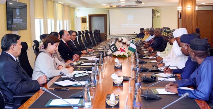 Federal Minister for Finance and Revenue, Senator Muhammad Aurangzeb holding a meeting with a 13-member delegation from the Revenue Mobilisation Allocation and Fiscal Commission (RMAFC) of Nigeria, led by Barrister Imo Effiong Akpan, Federal Commissioner, at the Finance Division