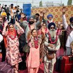 Indian Sikh pilgrims gesture upon their arrival in Pakistan after crossing the India-Pakistan Wagah Border on the eve of celebrations marking the birth anniversary of Guru Nanak, the founder of Sikhism. Nearly two thousand Sikh pilgrims from India entered Pakistan in the first major crossing since deadly clashes in May led to the closure of the land border between the two neighbouring countries
