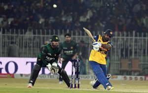 Sri Lankan batter Kusal Perera plays a shot during the T20I Tri-Nation Series match between Sri Lanka and Pakistan at Pindi Cricket Stadium