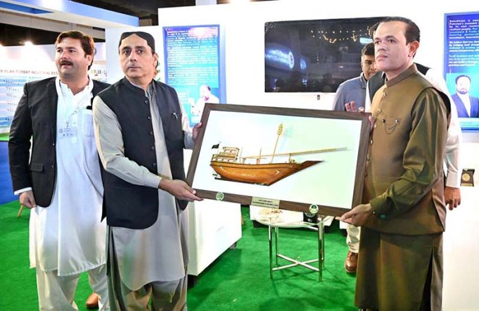 Minister for Livestock and Dairy Development Department Balochistan, Sardar Faisal Jamali, receives a souvenir during PIMEC 2025 at Expo Center Karachi