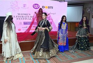 Art and Design students perform a cultural wedding-themed show on stage during the closing ceremony of the 3rd edition of the Dosti Peshawar Women’s Literature Festival 2025 at SBBWU.