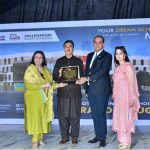 CEO of Roots Millennium Multan Campus, Dr. Faisal Mushtaq, presents a commemorative shield to Senate Chairman Syed Yusuf Raza Gillani