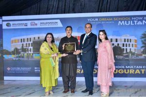 CEO of Roots Millennium Multan Campus, Dr. Faisal Mushtaq, presents a commemorative shield to Senate Chairman Syed Yusuf Raza Gillani