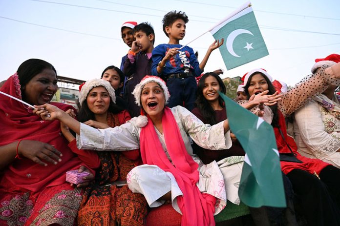Women and children participates in the Welcome Christmas Rally