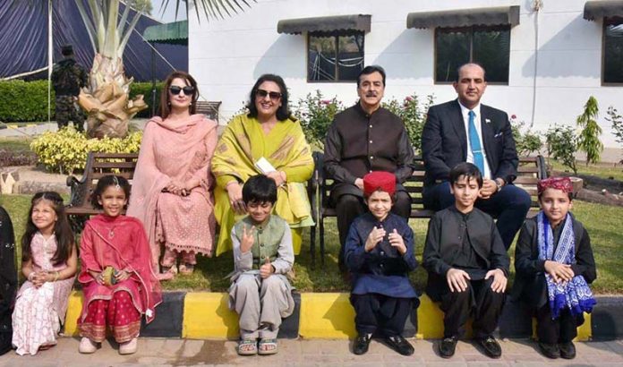 Chairman Senate of Pakistan, Syed Yusuf Raza Gilani, in a group photo with students during his visit to the Roots Millennium Multan Campus