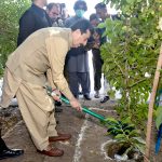 Acting President of Pakistan, Syed Yusuf Raza Gilani, plants saplings during his visit to Mahmood Group of Textile Mills
