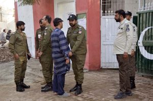 Security officials thoroughly checking voters before allowing entry into the polling station premises during the by-elections 2025