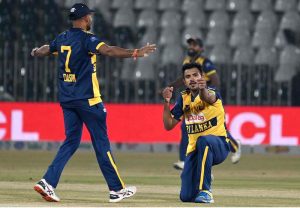 Sri Lanka’s Maheesh Theekshana hits the stumps to dismiss Zimbabwe’s Dion Myers in their Pakistan T20I Tri-Nation Series match at Rawalpindi Stadium..