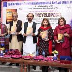 MNA Mehtab Akbar Rashdi, renowned dramatist, short story writer, poet, and columnist Noorul Huda Shah, along with others, displaying the book titled “SAG Encyclopedia” authored by Vice Chairman of SAG, Professor Khalid Hussain Channa, during its launching ceremony held at Bhittai Adabi Hall, Arts Council of Pakistan