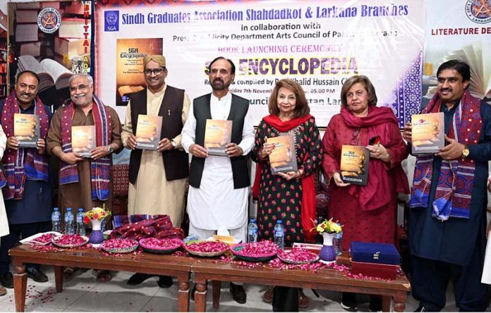 MNA Mehtab Akbar Rashdi, renowned dramatist, short story writer, poet, and columnist Noorul Huda Shah, along with others, displaying the book titled “SAG Encyclopedia” authored by Vice Chairman of SAG, Professor Khalid Hussain Channa, during its launching ceremony held at Bhittai Adabi Hall, Arts Council of Pakistan