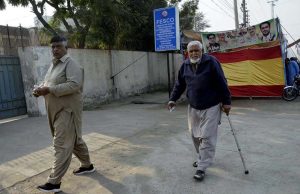 Security officials thoroughly checking voters before allowing entry into the polling station premises during the by-elections 2025
