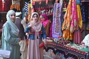 Woman visiting stalls during Ten-Day annual folk festival “Lok Mela 2025” at Lok Virsa in the Federal Capital.