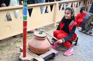 Woman visiting stalls during Ten-Day annual folk festival “Lok Mela 2025” at Lok Virsa in the Federal Capital.