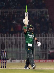 Pakistani batter Sahibzada Farhan raises his bat to celebrate his fifty during the Pakistan T20I Tri-Nation Series cricket match between Zimbabwe and Pakistan at Pindi Cricket Stadium