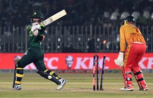 Pakistani batter Sahibzada Farhan raises his bat to celebrate his fifty during the Pakistan T20I Tri-Nation Series cricket match between Zimbabwe and Pakistan at Pindi Cricket Stadium