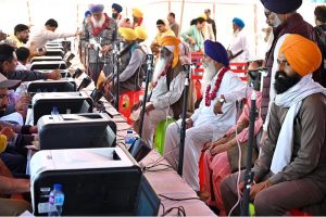 Indian Sikh pilgrims exchanging indian currency into Pakistani rupees after their arrival in Pakistan after crossing the India-Pakistan Wagah Border on the eve of celebrations marking the birth anniversary of Guru Nanak, the founder of Sikhism. Nearly two thousand Sikh pilgrims from India entered Pakistan in the first major crossing since deadly clashes in May led to the closure of the land border between the two neighbouring countries