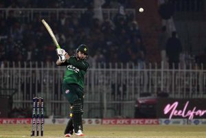 Pakistani batter Sahibzada Farhan raises his bat to celebrate his fifty during the Pakistan T20I Tri-Nation Series cricket match between Zimbabwe and Pakistan at Pindi Cricket Stadium