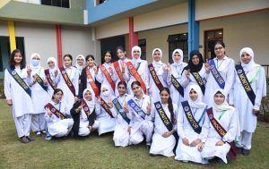 State Minister for Education, Wajiha Qamar confers sashes to student in oath taking ceremony of Students Council at Model College for Girls F-10/2