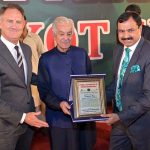 Senior Pastor Anwar Afzal presenting a shield to Defense Minister Khawaja Muhammad Asif at prayer ceremony for the Christian community at City Ground