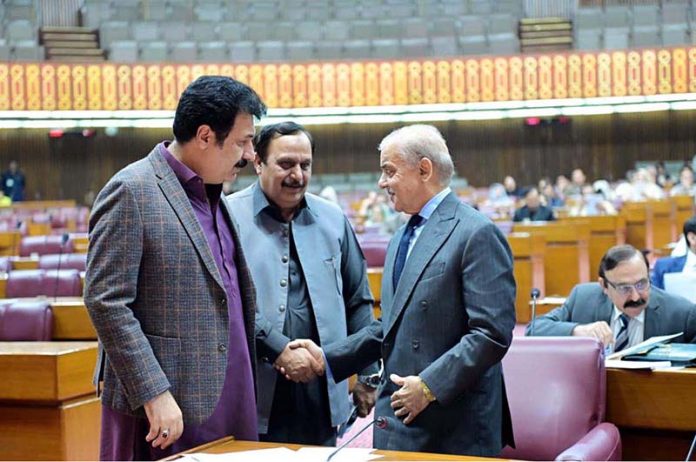 Prime Minister Muhammad Shehbaz Sharif interacts with the MNAs during the National Assembly session