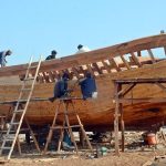 Workers preparing a new fishing boat in Ibrahim Hyderi, highlighting the traditional craftsmanship that sustains one of Karachi’s oldest fishing villages