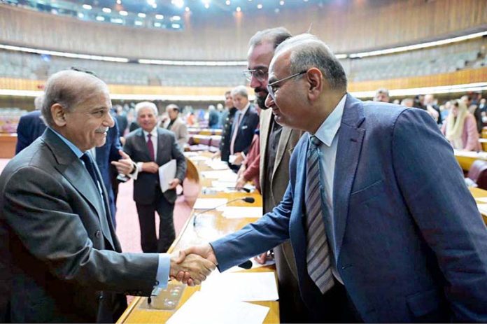 Prime Minister Muhammad Shehbaz Sharif interacts with the MNAs during the National Assembly session