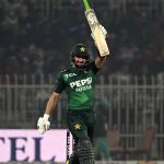 Pakistani batter Sahibzada Farhan raises his bat to celebrate a half-century during the T20I Tri-Nation Series match between Sri Lanka and Pakistan at Pindi Cricket Stadium
