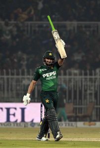 Pakistani batter Sahibzada Farhan raises his bat to celebrate a half-century during the T20I Tri-Nation Series match between Sri Lanka and Pakistan at Pindi Cricket Stadium