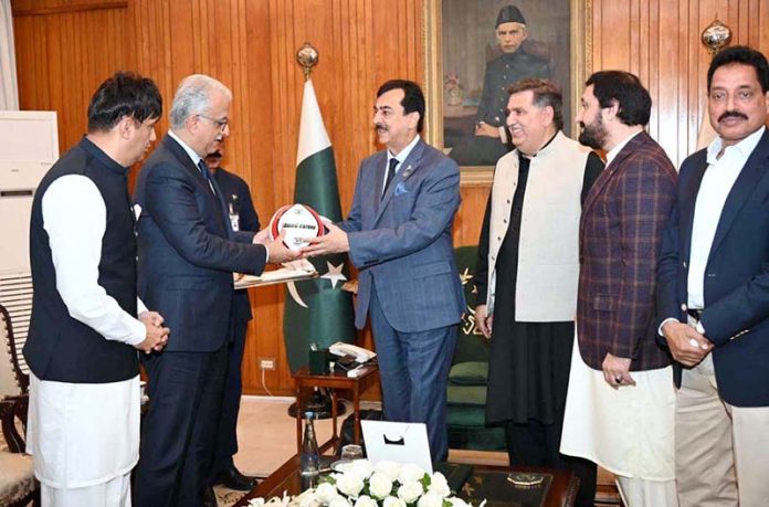 President of the Asian Football Confederation (AFC) and Senior Vice President of FIFA, H.E. Shaikh Salman Ebrahim Hamid Al Khalifa, presents a football to Acting President Syed Yousuf Raza Gilani at Aiwan-e-Sadr