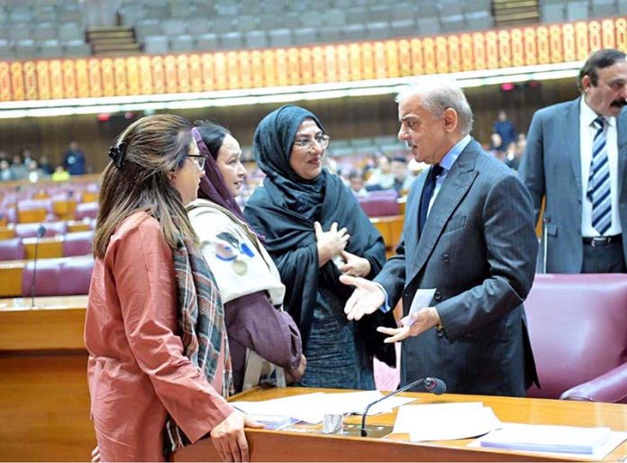 Prime Minister Muhammad Shehbaz Sharif interacts with the MNAs during the National Assembly session