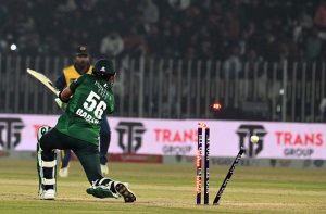 Pakistani batter Sahibzada Farhan raises his bat to celebrate a half-century during the T20I Tri-Nation Series match between Sri Lanka and Pakistan at Pindi Cricket Stadium