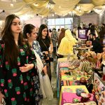 Women visit stalls at the Crafters Expo 2025