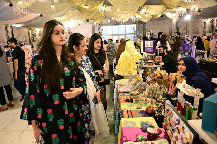 Women visit stalls at the Crafters Expo 2025