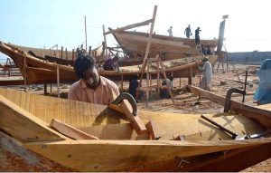 A fisherman unloads fish in Ibrahim Hyderi supply to the city