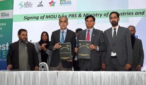Chief Statistician, Pakistan Bureau of Statistics (PBS), Dr. Naeem-Uz- Zafar, and SS/RM PBS, Muhammad Sarwar Gondal, with documents after signing of MoU between PBS and Ministry of Industries and Production during the closing ceremony of Data Fest 2025 at Pak-China Centre for International Cooperation