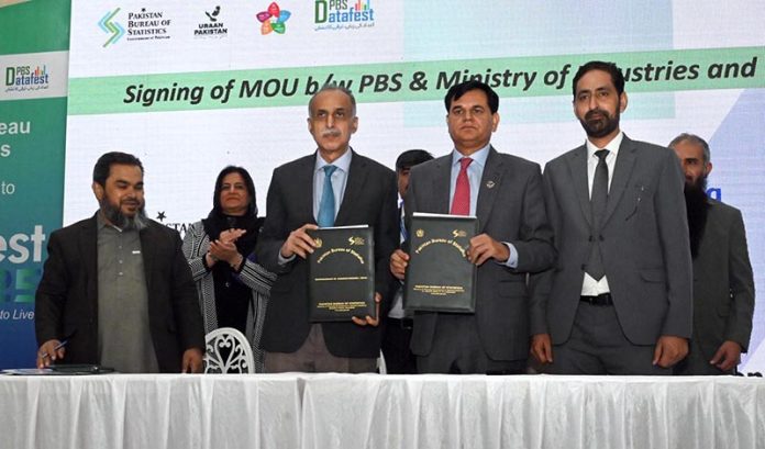 Chief Statistician, Pakistan Bureau of Statistics (PBS), Dr. Naeem-Uz- Zafar, and SS/RM PBS, Muhammad Sarwar Gondal, with documents after signing of MoU between PBS and Ministry of Industries and Production during the closing ceremony of Data Fest 2025 at Pak-China Centre for International Cooperation