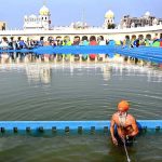 Sikh yatrees performing their religious rituals on the occasion of 556th birth anniversary of Guru Nanak Dev in Nankana Sahib, Guru Nanak was the founder of the religion of Sikhism and the first of ten Sikh Gurus. His birth is celebrated worldwide as Guru Nanak Gurpurab on Kartik Pooranmashi, the full-moon day in the month of Katak, October–November