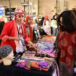 Women visit stalls at the Crafters Expo 2025
