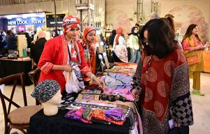 Women visit stalls at the Crafters Expo 2025
