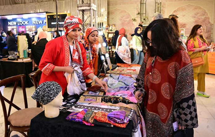 Women visit stalls at the Crafters Expo 2025