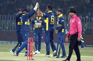 Sri Lankan players celebrates a wicket of Pakistani batter Haseebullah Khan during the 3rd one day international cricket match between Pakistan and Sri Lanka at Pindi Cricket Stadium.