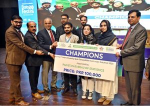 Chief Statistician, Pakistan Bureau of Statistics (PBS), Dr. Naeem Uz Zafar, and SS/RM PBS, Muhammad Sarwar Gondal, distribute awards and cheques among participants of Quiz, Poster, and Project competitions during the closing ceremony of DataFest-2025 at the Pak-China Friendship Centre