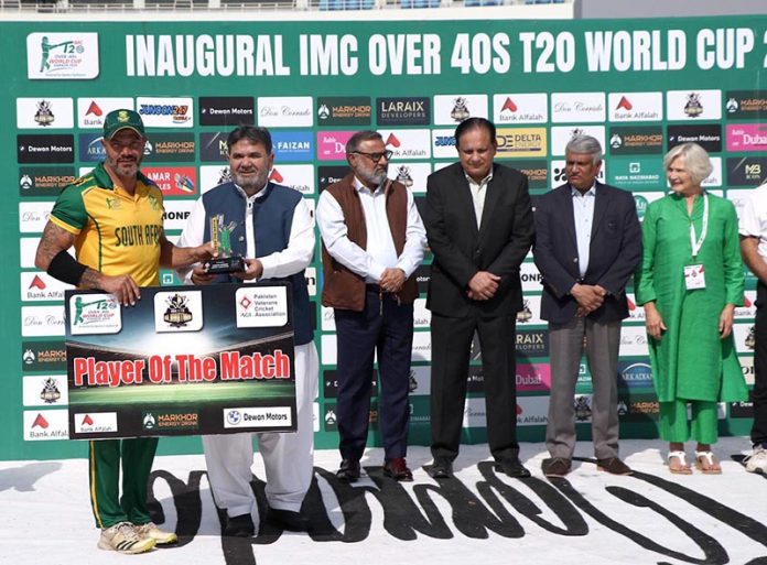 Chairman Senate Standing Committee on Cabinet Secretariat Senator Rana Mahmood-ul-Hassan present Player of the match award to South Africa player Stephan Joubert after winning the cricket match against West Indies during the IMC over 40s T20 World Cup 2025 at National Stadium