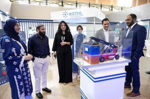 A naval officer briefing female visitors at a stall established during the 2nd Edition of Pakistan International Maritime Expo and Conference 2025 at Expo Centre