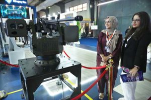 A naval officer briefing female visitors at a stall established during the 2nd Edition of Pakistan International Maritime Expo and Conference 2025 at Expo Centre