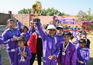 Smart School children celebrate after winning the Sports Gala Winner’s Trophy.