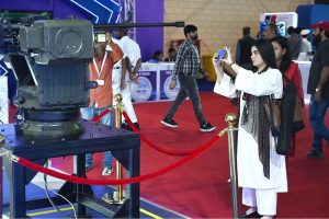 A naval officer briefing female visitors at a stall established during the 2nd Edition of Pakistan International Maritime Expo and Conference 2025 at Expo Centre